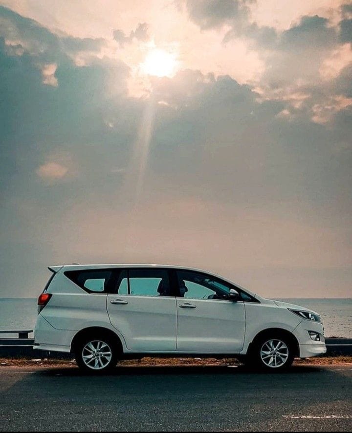White Toyota Innova Crysta by the sea